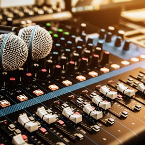 Microphone with sound mixer in studio workplace for live the media and sound recording equipment and sound system concept.
